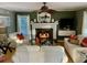 Inviting living room with fireplace, white sofas, and hardwood floors at 323 Dewpoint Ct # 35, Marietta, GA 30064
