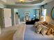 A serene bedroom includes an attached sitting room with a blue accent wall and white door at 323 Dewpoint Ct # 35, Marietta, GA 30064