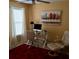 Bright office features a glass desk, white blinds, and colorful landscape art for a cozy workspace at 323 Dewpoint Ct # 35, Marietta, GA 30064