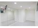 A full wall mirror reflects light and enhances the size of this basement bonus room at 5685 Commons Ln, Alpharetta, GA 30005