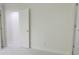 Bright, neutral bedroom with plush carpeting and natural light from an open doorway at 5685 Commons Ln, Alpharetta, GA 30005