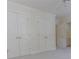 Bedroom featuring carpet, a ceiling fan, and ample closet space at 5685 Commons Ln, Alpharetta, GA 30005