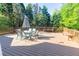 Spacious deck offers plenty of room for outdoor entertaining with a dining set and bench seating at 5685 Commons Ln, Alpharetta, GA 30005