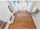 Aerial view of a living room with a chandelier, fireplace, and hardwood floors at 5685 Commons Ln, Alpharetta, GA 30005