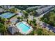 Aerial view of community amenities, including tennis courts and a large swimming pool at 7850 Willoughby Ct, Alpharetta, GA 30005