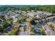Aerial view of residential community with mature trees, manicured lawns, and ample parking at 7850 Willoughby Ct, Alpharetta, GA 30005