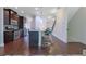 Bright kitchen with dark wood floors and cabinets and stainless steel appliances at 7850 Willoughby Ct, Alpharetta, GA 30005