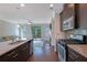 Spacious kitchen featuring a large island, stainless steel appliances, and an open floor plan leading to the living area at 7850 Willoughby Ct, Alpharetta, GA 30005