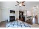 Open-concept living area with fireplace, kitchen access, and modern finishes at 7850 Willoughby Ct, Alpharetta, GA 30005