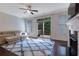 Comfortable living room with sliding door to a deck, fireplace and neutral color palette at 7850 Willoughby Ct, Alpharetta, GA 30005