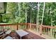 Relax on this back deck with table and chairs and a beautiful view of the surrounding lush greenery at 101 Stroud Se Dr, Mableton, GA 30126