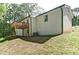 Rear view of house showing raised back deck on landscaped lot at 101 Stroud Se Dr, Mableton, GA 30126
