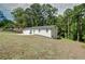 Charming white brick home with a green front door and a well-manicured lawn at 101 Stroud Se Dr, Mableton, GA 30126