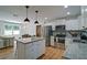 Bright, open kitchen with stainless appliances and granite counters flows to a living area with lots of natural light at 101 Stroud Se Dr, Mableton, GA 30126