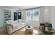 Inviting living room with a white sofa, green armchairs, and large window with natural light at 101 Stroud Se Dr, Mableton, GA 30126