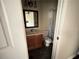 A look into the bathroom with toilet, shower, vanity and mirror at 142 Davis Mill Ct, Lawrenceville, GA 30044
