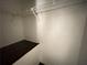 Walk-in closet features a shelf and a hanging rod at 142 Davis Mill Ct, Lawrenceville, GA 30044