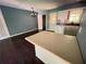 Open kitchen layout featuring a center island, stainless steel sink, and a view of the dining area at 142 Davis Mill Ct, Lawrenceville, GA 30044