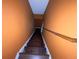 Long wooden stairs leading to another level of the home at 142 Davis Mill Ct, Lawrenceville, GA 30044