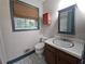 Cozy bathroom with patterned flooring, vanity, toilet and a wood blind at 1517 Colony East Cir, Stone Mountain, GA 30083