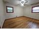 Spacious bedroom with hardwood floors, ceiling fan and two windows at 1517 Colony East Cir, Stone Mountain, GA 30083