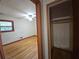 View of the empty bedroom and closet featuring hardwood floors, and natural lighting from window at 1517 Colony East Cir, Stone Mountain, GA 30083