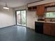 Cozy kitchen area with older appliances and a view of the backyard through the back door at 1517 Colony East Cir, Stone Mountain, GA 30083