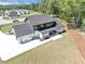 Aerial view of the home showcasing its large lot, covered patio and outdoor kitchen at 2577 Kilgore Rd, Buford, GA 30519