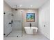 Modern bathroom featuring a walk-in shower and a free-standing tub at 2577 Kilgore Rd, Buford, GA 30519