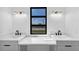 Bright bathroom featuring double sinks and stylish gold light fixtures at 2577 Kilgore Rd, Buford, GA 30519