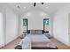 Bright bedroom featuring hardwood floors and large windows at 2577 Kilgore Rd, Buford, GA 30519