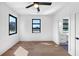 Spacious bedroom featuring dark framed windows and hardwood flooring at 2577 Kilgore Rd, Buford, GA 30519