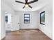 Bedroom with hardwood floors, large windows, and an attached bathroom at 2577 Kilgore Rd, Buford, GA 30519