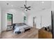 Airy bedroom with a ceiling fan, hardwood floors, and abundant natural light at 2577 Kilgore Rd, Buford, GA 30519