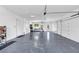 Spacious three car garage with epoxy flooring and ample storage space at 2577 Kilgore Rd, Buford, GA 30519