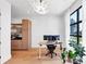 Modern office space with hardwood floors, stylish light fixture and built-in shelving at 2577 Kilgore Rd, Buford, GA 30519