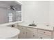 Wet bar featuring bright white cabinets and countertops, with stainless sink at 3240 Corktree Trl, Stonecrest, GA 30038
