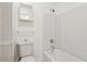 Bathroom featuring a toilet, tub/shower combo, and a mirrored medicine cabinet at 3240 Corktree Trl, Stonecrest, GA 30038