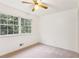 Bright bedroom with a ceiling fan and large window at 3240 Corktree Trl, Stonecrest, GA 30038