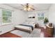 Cozy bedroom with hardwood floors, neutral decor, and plenty of natural light at 3240 Corktree Trl, Stonecrest, GA 30038