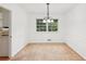 Classic dining room featuring neutral carpet, a chandelier and bright white walls at 3240 Corktree Trl, Stonecrest, GA 30038