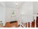 Bright entryway with hardwood floors, staircase and front door that offers natural light at 3240 Corktree Trl, Stonecrest, GA 30038