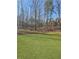 Expansive backyard with mature trees offering privacy and natural beauty at 5301 Tuscany Dr, Douglasville, GA 30135