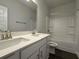 This bathroom features double sinks, a bath tub and large mirror at 5301 Tuscany Dr, Douglasville, GA 30135