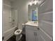 Bathroom featuring a shower-tub combo, single sink vanity, and clean, modern finishes at 5301 Tuscany Dr, Douglasville, GA 30135