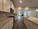 Bright kitchen features white cabinets, granite counters, and stainless appliances at 5301 Tuscany Dr, Douglasville, GA 30135