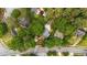 Aerial view of a property nestled among mature trees, showcasing its proximity to a neighborhood street at 1590 Johnson Ne Rd, Atlanta, GA 30306