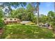 Expansive backyard featuring a well-manicured lawn, a patio with a fire pit, and a detached garage at 1590 Johnson Ne Rd, Atlanta, GA 30306