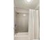 Bright bathroom featuring a tub and shower combination with a white shower curtain at 1590 Johnson Ne Rd, Atlanta, GA 30306