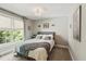 Cozy bedroom features a large window, neutral tones and plush carpeting at 1590 Johnson Ne Rd, Atlanta, GA 30306
